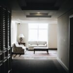 white 2-piece sofa and brown wooden coffee table