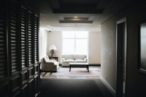 white 2-piece sofa and brown wooden coffee table